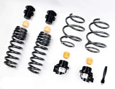Set of AST adjustable lowering springs for BMW M5 F90, including springs of various sizes, height adjusters, and other components.